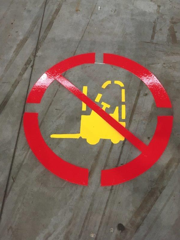 Floor marking: No forklifts allowed, depicted by a yellow forklift crossed out with a red circle and slash.
