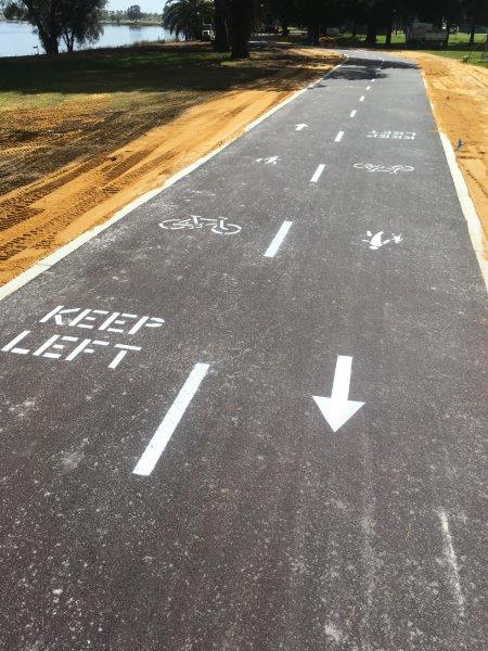 Asphalt path with lane markings and 