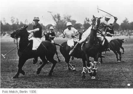 Polo match in Berlin, 1936. Players on horseback, swinging mallets. Several horses are running.