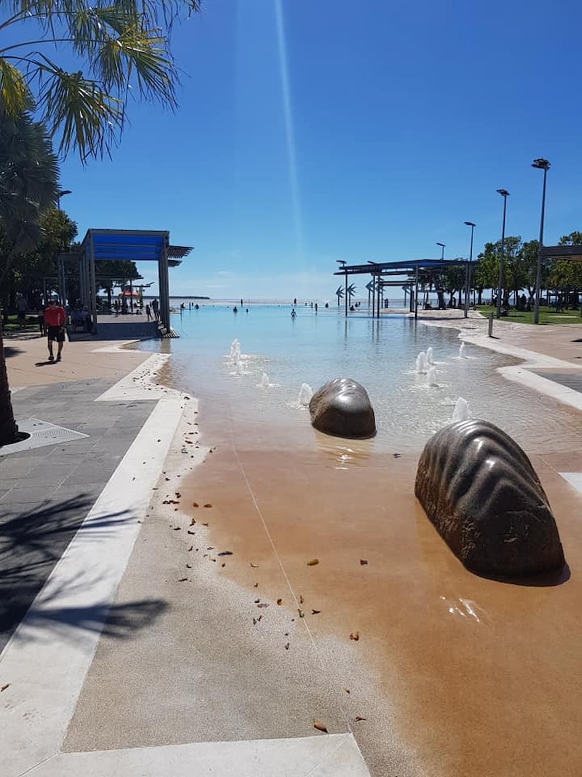 A Large Body Of Water With A Fountain In The Middle Of It — Vibrant Health - Vibrant Life In Yorkeys Knob, QLD