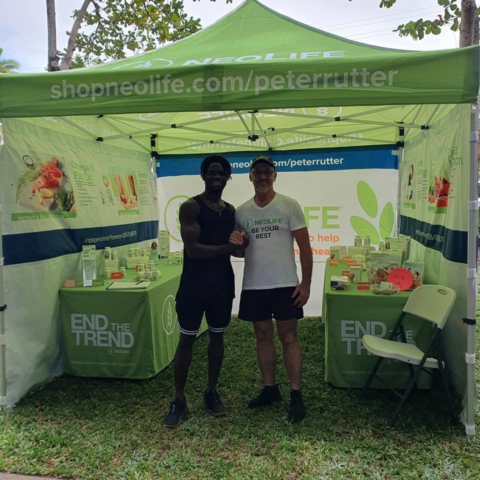 Two Men Standing Under A Green Tent — Vibrant Health - Vibrant Life In Yorkeys Knob, QLD