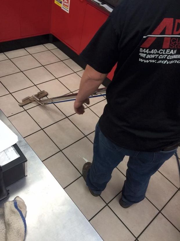 A man wearing a black shirt that says a on it