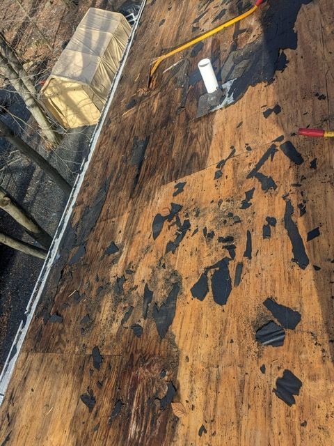 A roof with a lot of pieces of wood on it