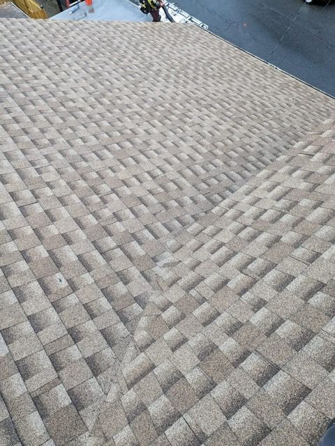 A close up of a roof with a lot of tiles on it.