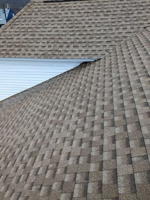 A close up of a roof with shingles on it.