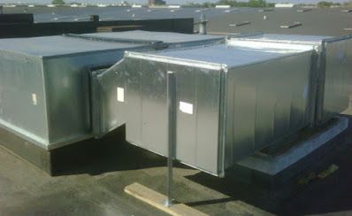 A metal duct on the roof of a building.