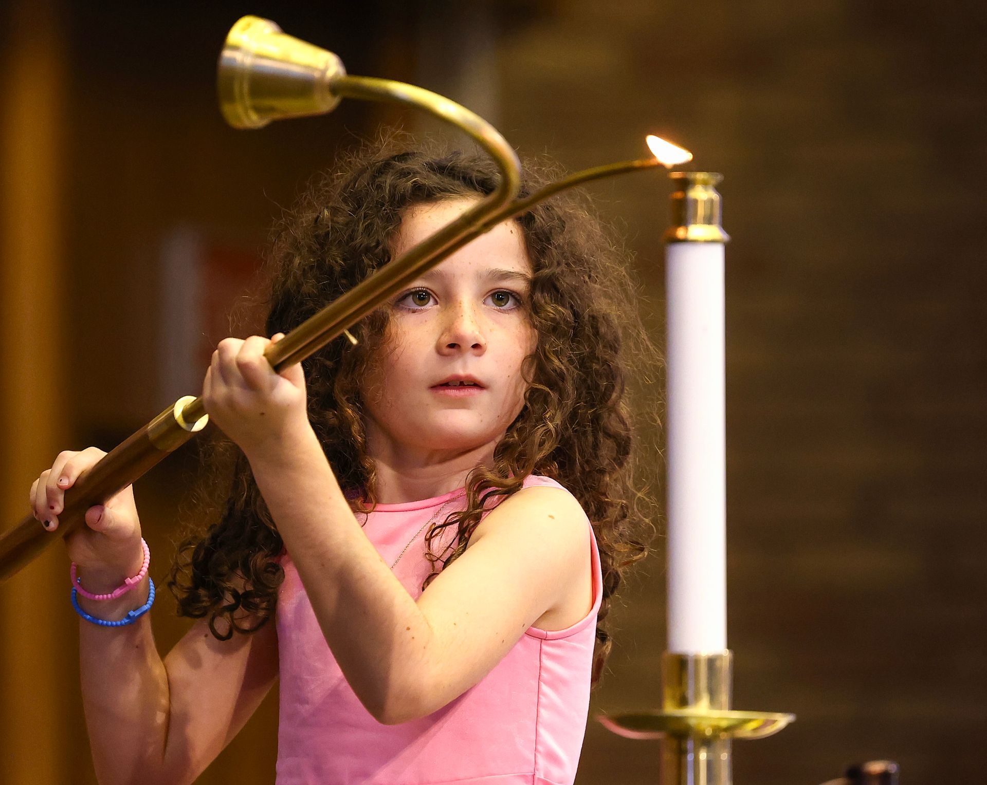 Child lighting candle