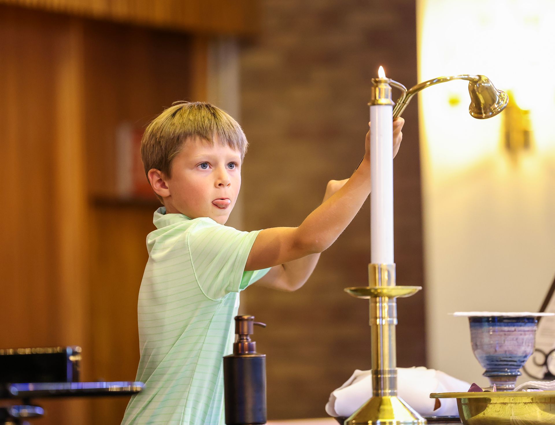 Boy lighting candle