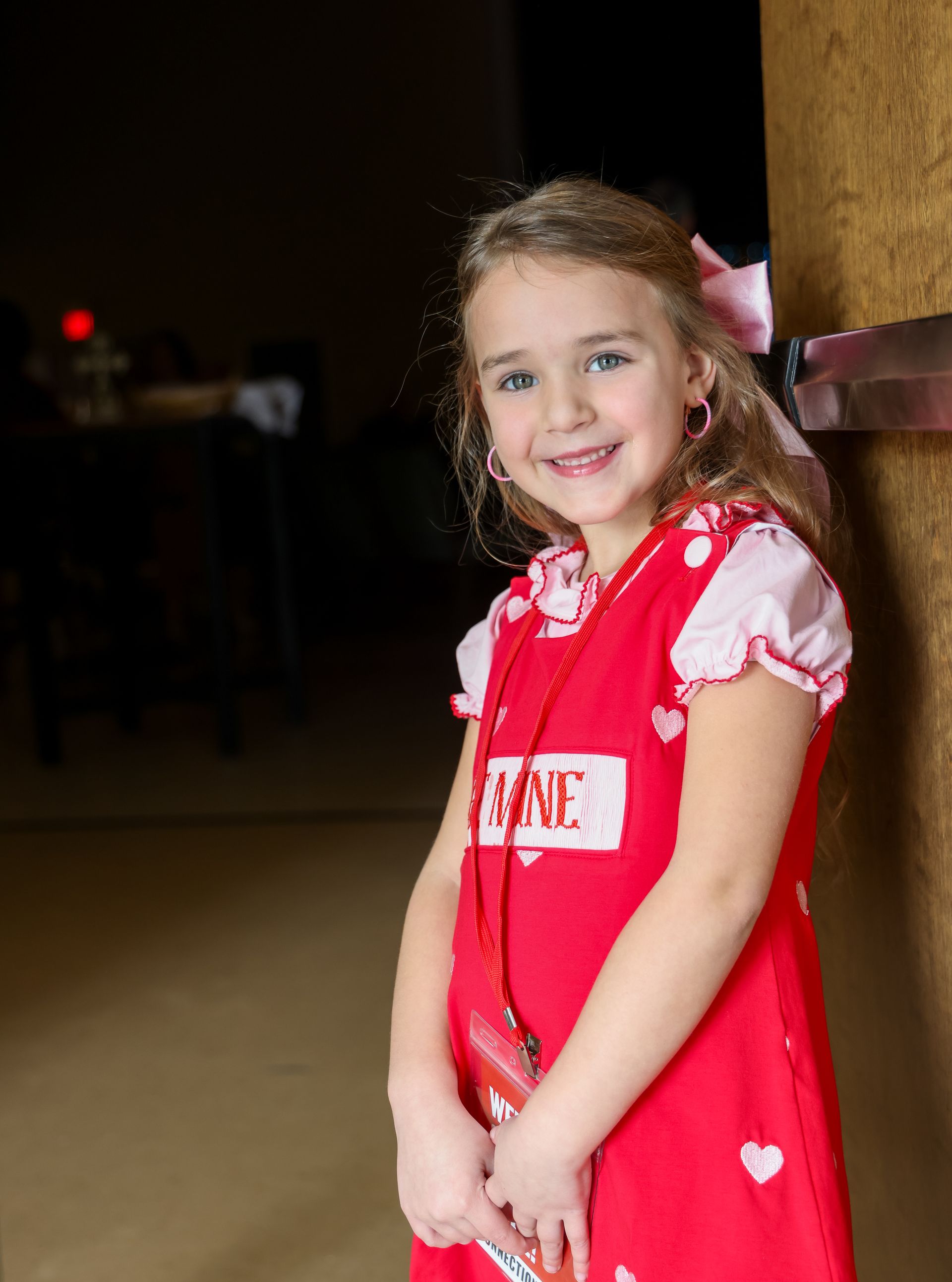 Child serving as a door greeter