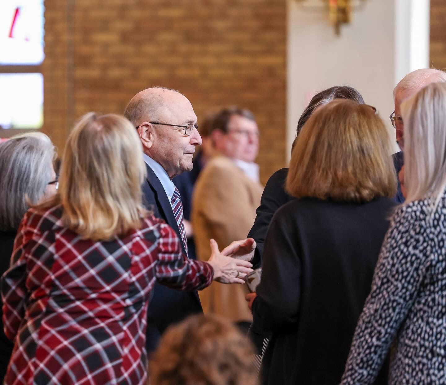 Church members greeting each other