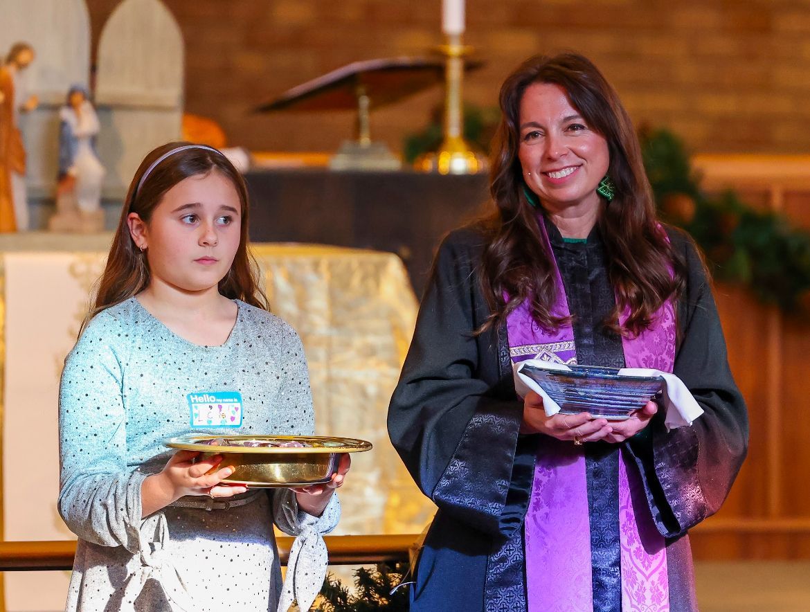Pastor and student during communion