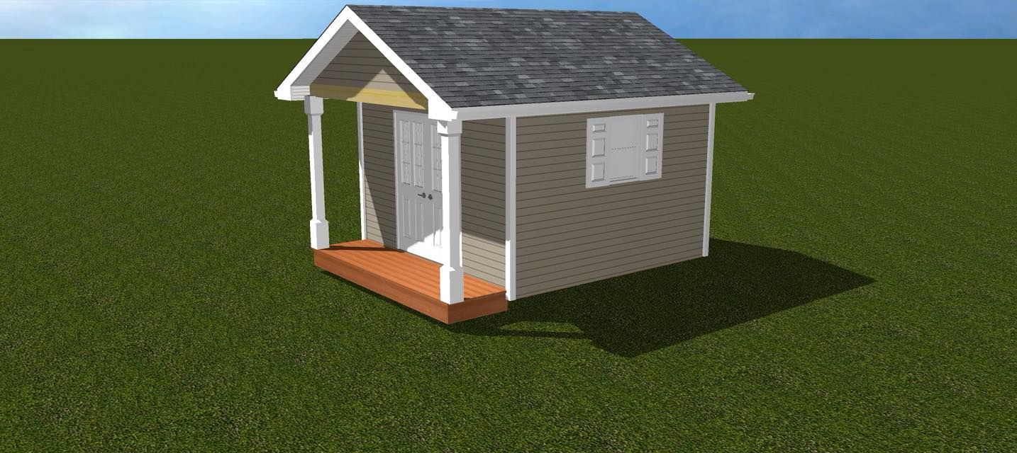 Small gray shed on a green field under a blue sky.