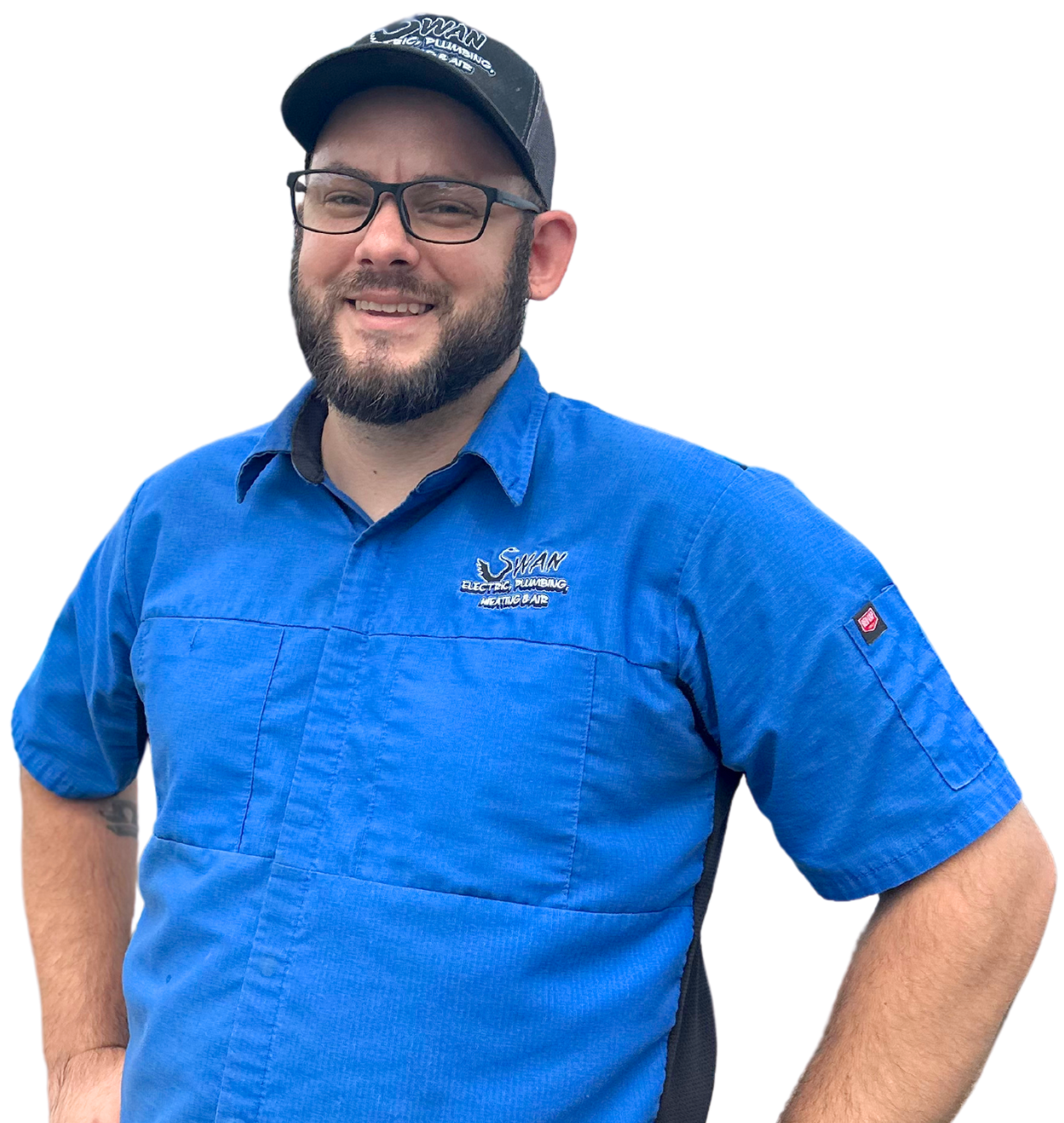 A man with a beard wearing a blue shirt and a black hat