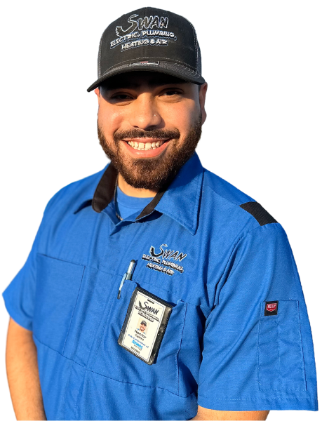 A man with a beard wearing a blue shirt and a black hat