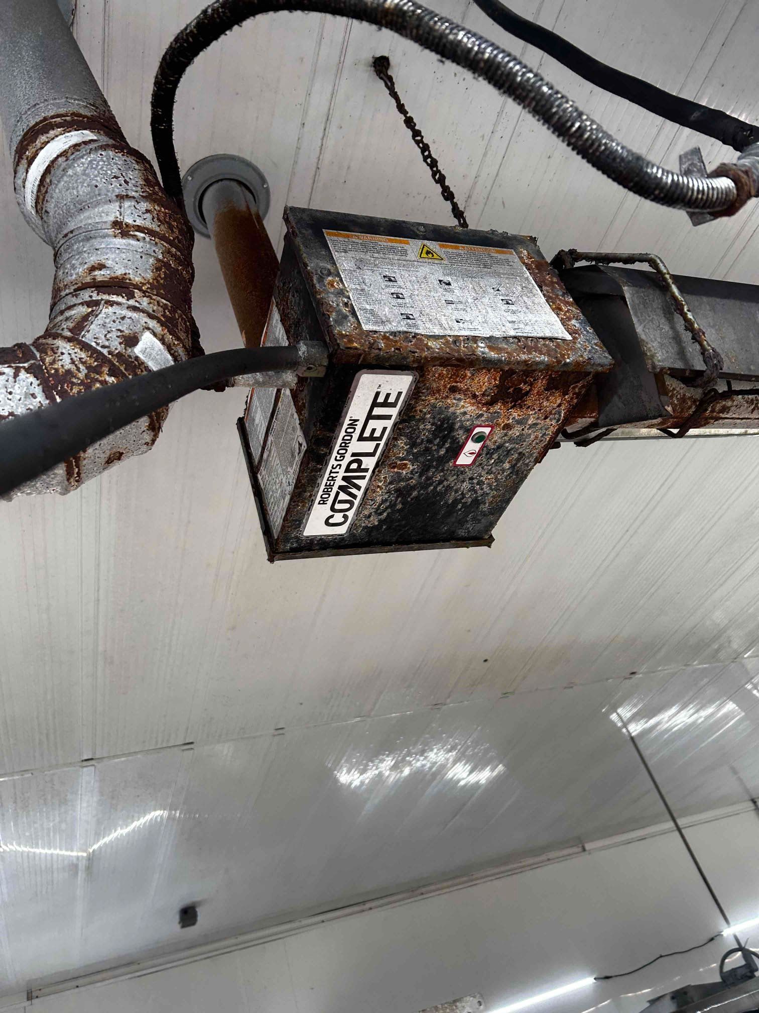 old rusty commercial tube heater