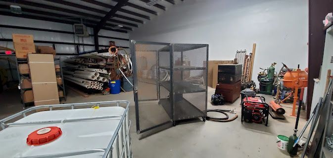A warehouse filled with lots of equipment and boxes.
