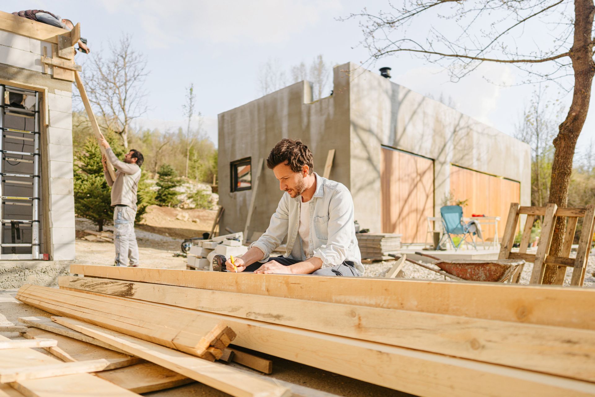 Carpenter Arranging and Measuring Planks | Vermont, Vic | Apollonio Carpentry