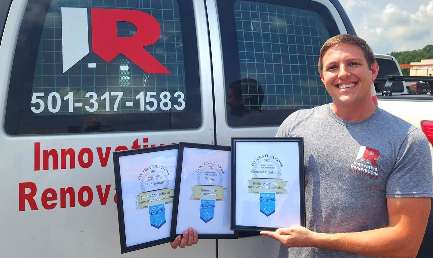 A man is standing in front of a van that says innova renov
