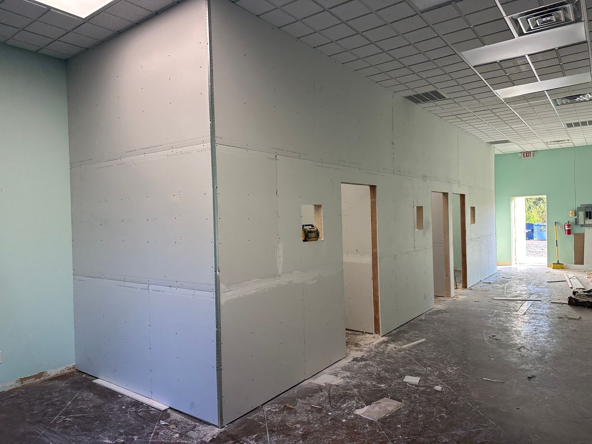 A room with a lot of drywall walls and a ceiling.