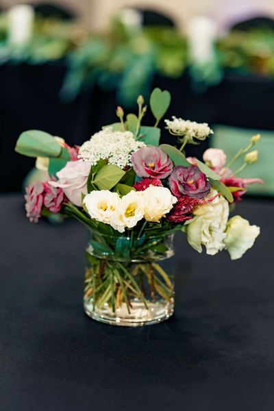 A vase filled with flowers is sitting on a table.