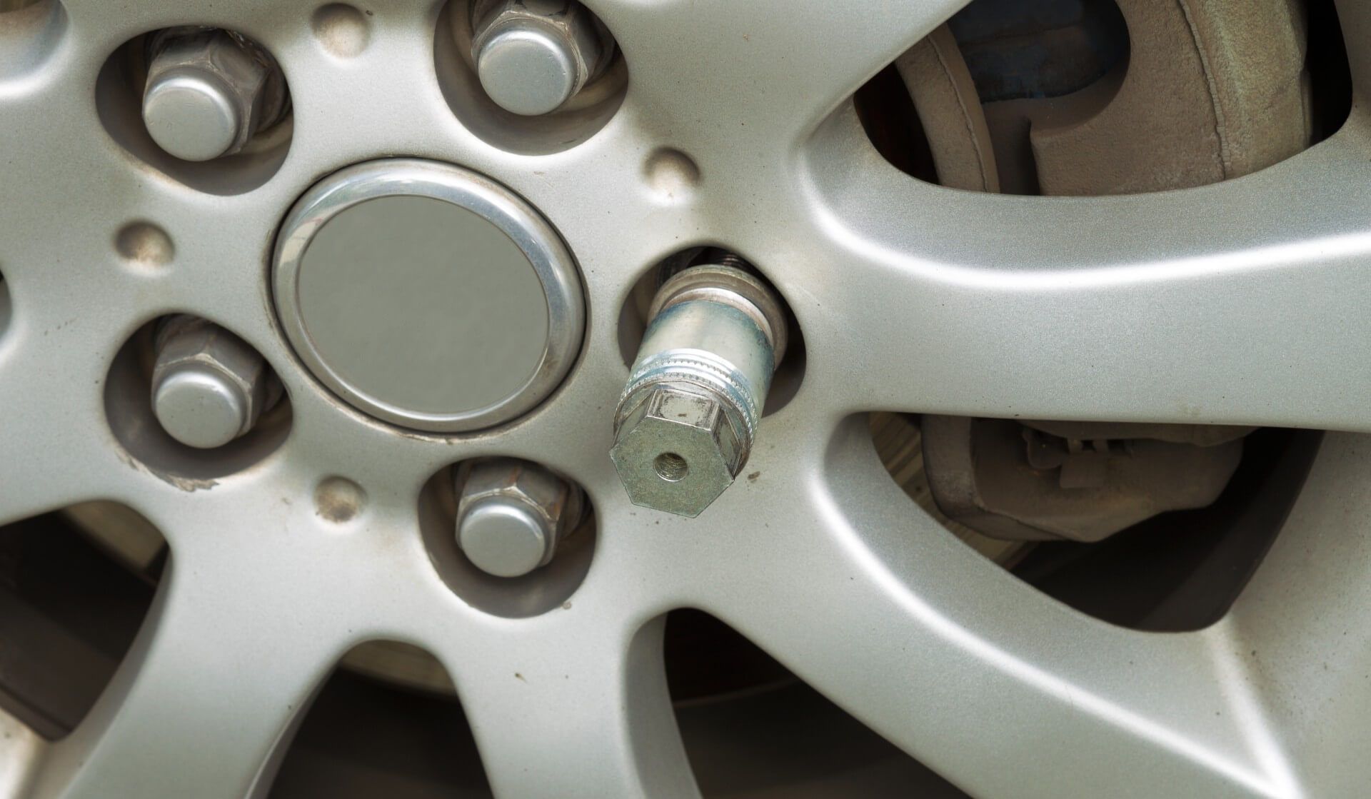 A wheel lock key in the hubcap of a car's wheel