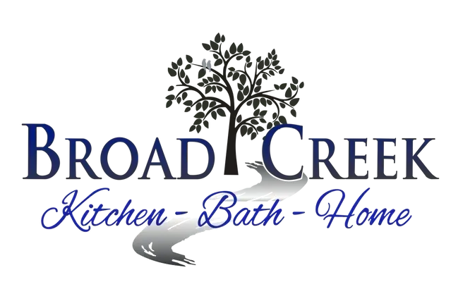 Logo for Broad Creek Kitchen-Bath-Home, featuring text, a tree, and a water stream.