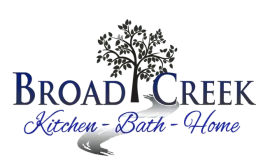 Logo for Broad Creek Kitchen-Bath-Home, featuring text, a tree, and a water stream.