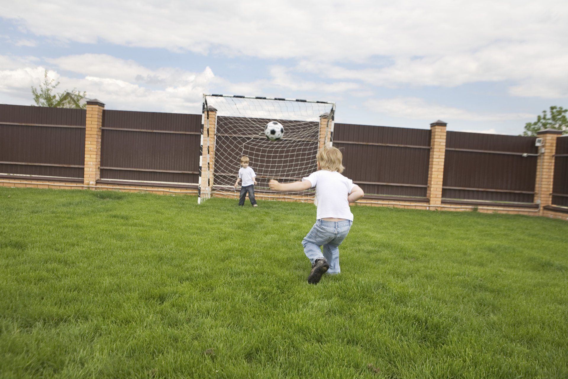 Kids Playing on Grass — Wilmington, NC — Turf Masters Sod Farms