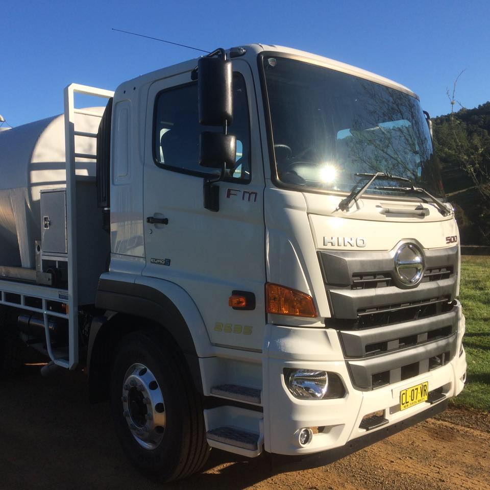 A water cartage truck with the word hino on the front — Nabiac Water Carriers In Belbora NSW
