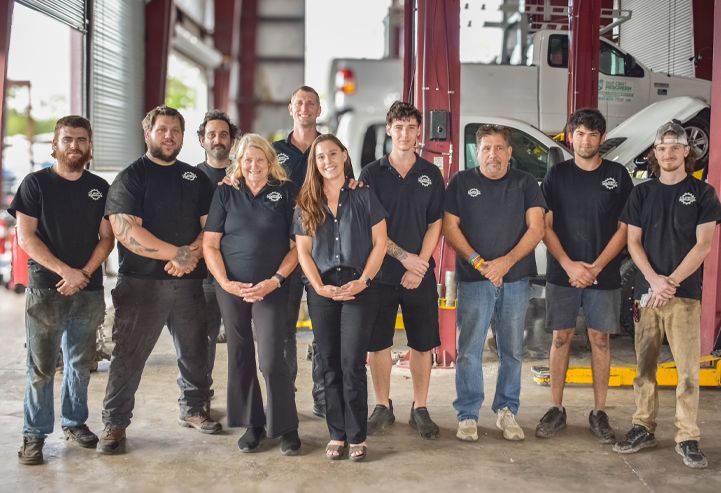 Man giving keys to customer at desk | Curry Truck & Auto