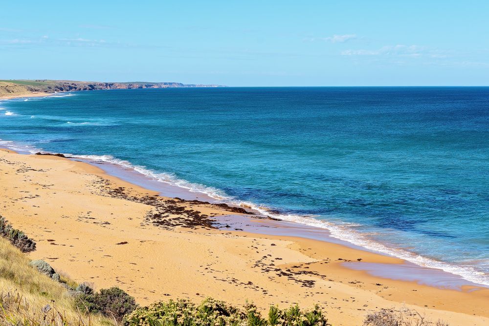 A Sandy Beach Next To A Large Body Of Water — Torquay & Anglesea Accident Towing Centre In Aireys Inlet, VIC