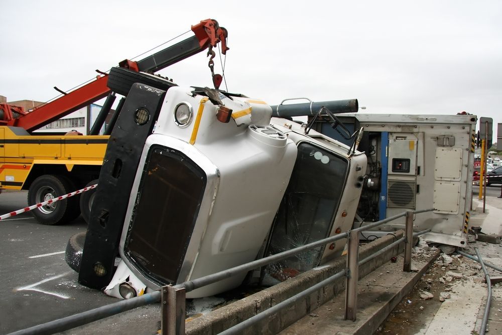 A White Truck Is Being Towed By A Yellow Tow Truck — Torquay & Anglesea Accident Towing Centre In Torquay, VIC