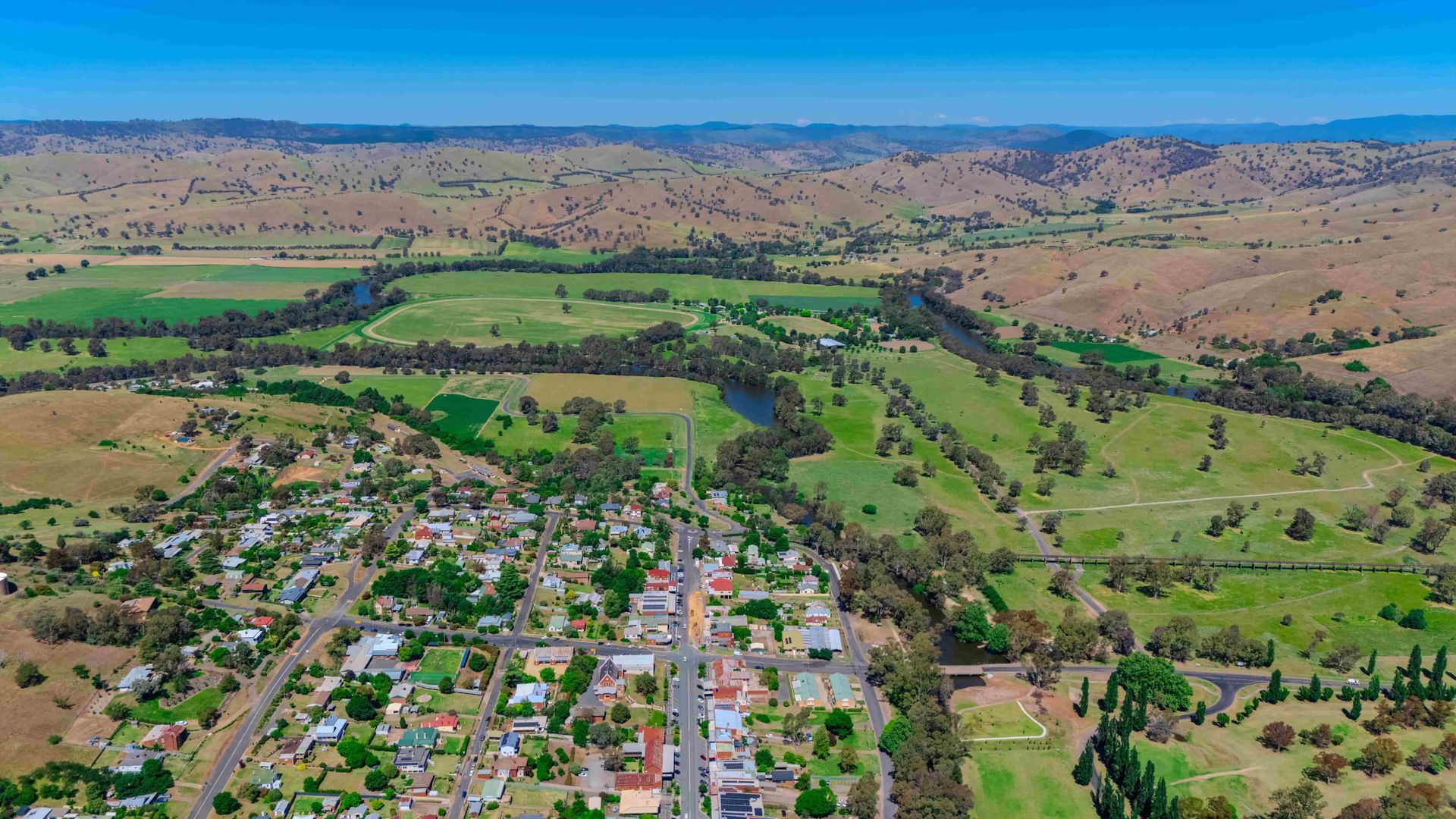 An Aerial View Of A Small Town Surrounded By Fields And A River — Torquay & Anglesea Accident Towing Centre In Big Hill, VIC