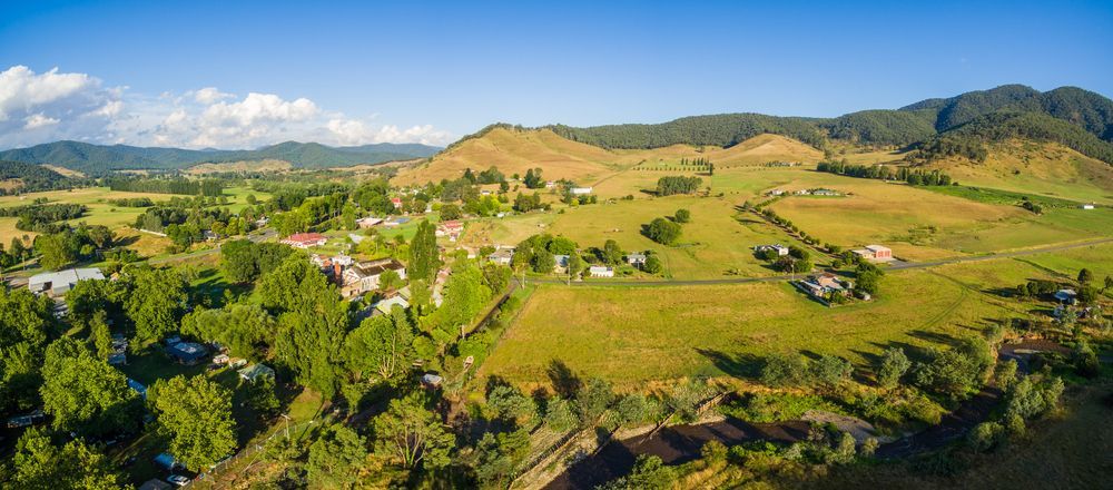 An Aerial View Of A Lush Green Valley With Mountains — Torquay & Anglesea Accident Towing Centre In Drysdale, VIC