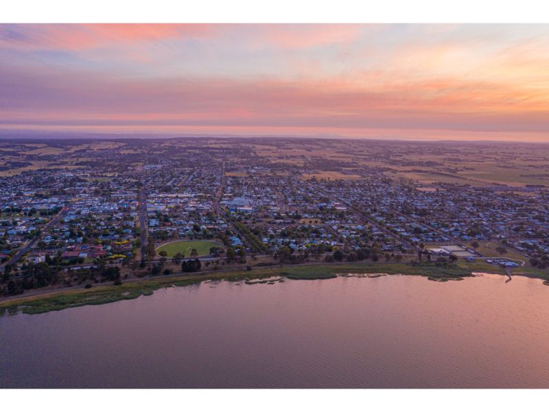 An Aerial View Of A City And A Lake At Sunset — Torquay & Anglesea Accident Towing Centre In Colac, VIC