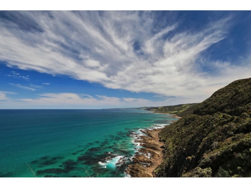 A Cliff Overlooking The Ocean With A Blue Sky And Clouds — Torquay & Anglesea Accident Towing Centre In Otways, VIC