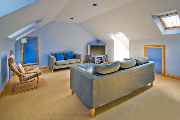 A loft conversion that has been utilised as a lounge
