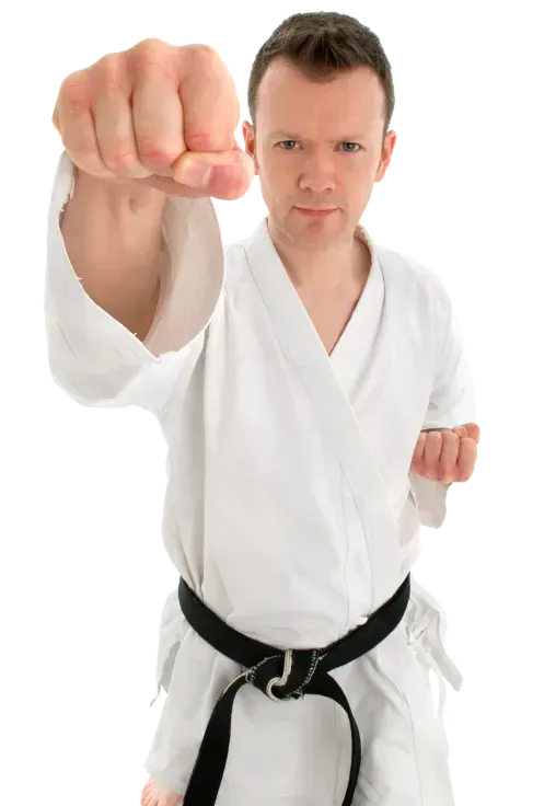 A young man in a white karate uniform with a black belt