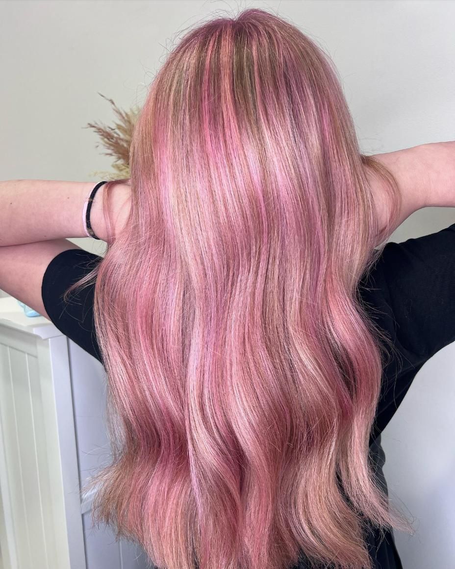 A Woman with Long Pink Hair Is Standing with Her Hands Behind Her Head — Losh Hair Lounge In Toowoomba City, QLD