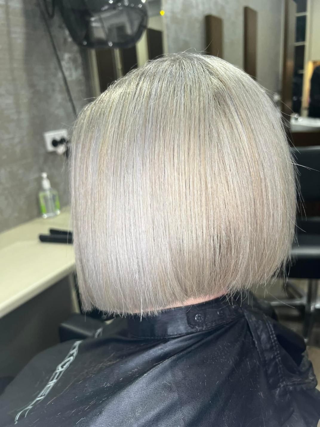 A Woman Is Getting Her Hair Cut in A Salon — Losh Hair Lounge In Toowoomba City, QLD