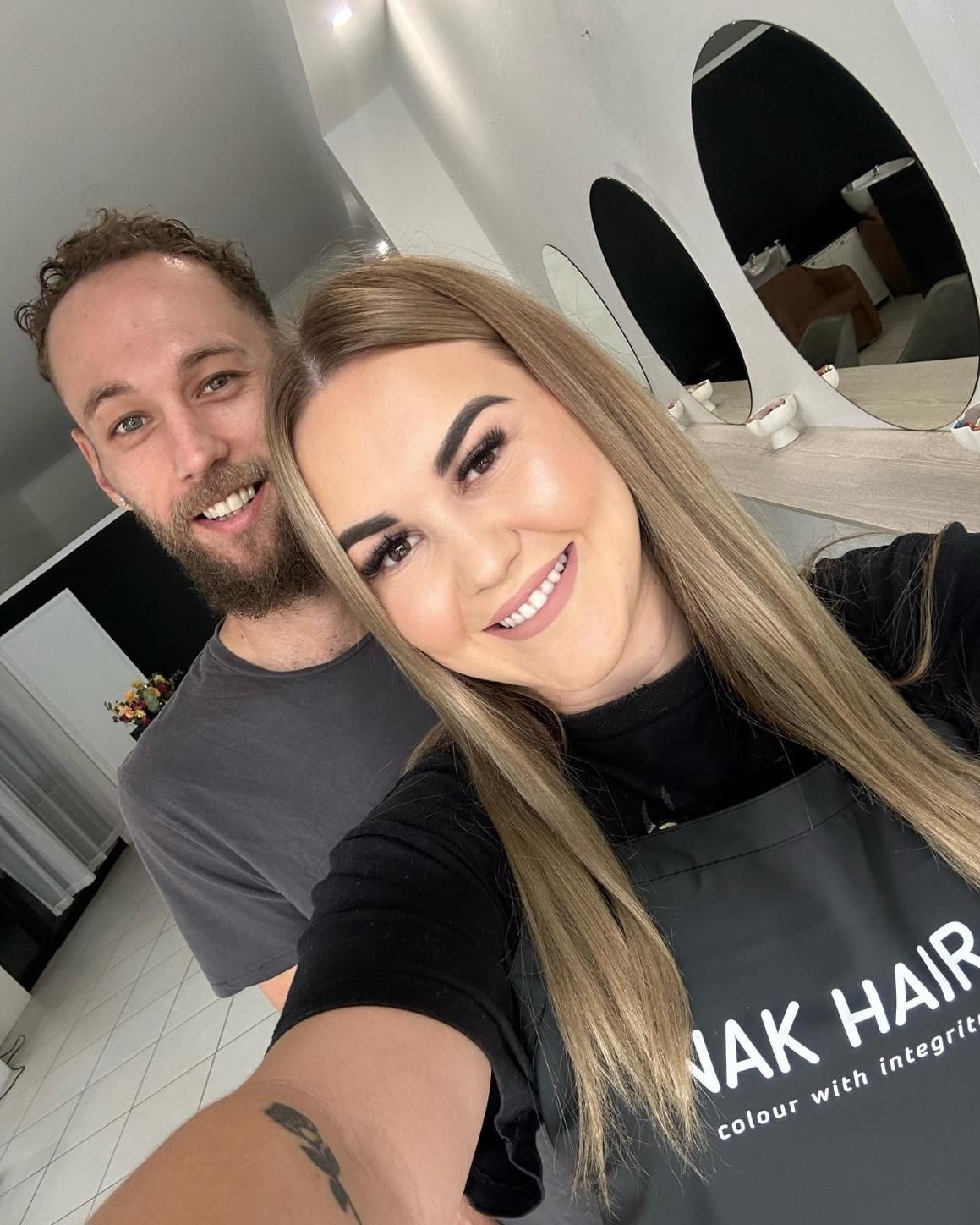 A Man and A Woman Are Posing for A Selfie in A Salon — Losh Hair Lounge In Toowoomba City, QLD