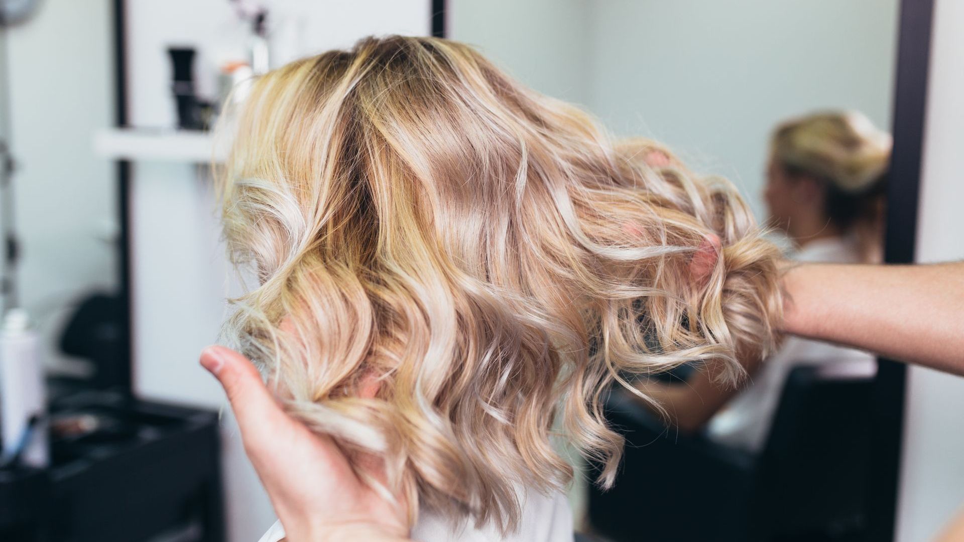 A Woman is Getting Her Hair Dyed in a Salon — Losh Hair Lounge In Toowoomba City, QLD