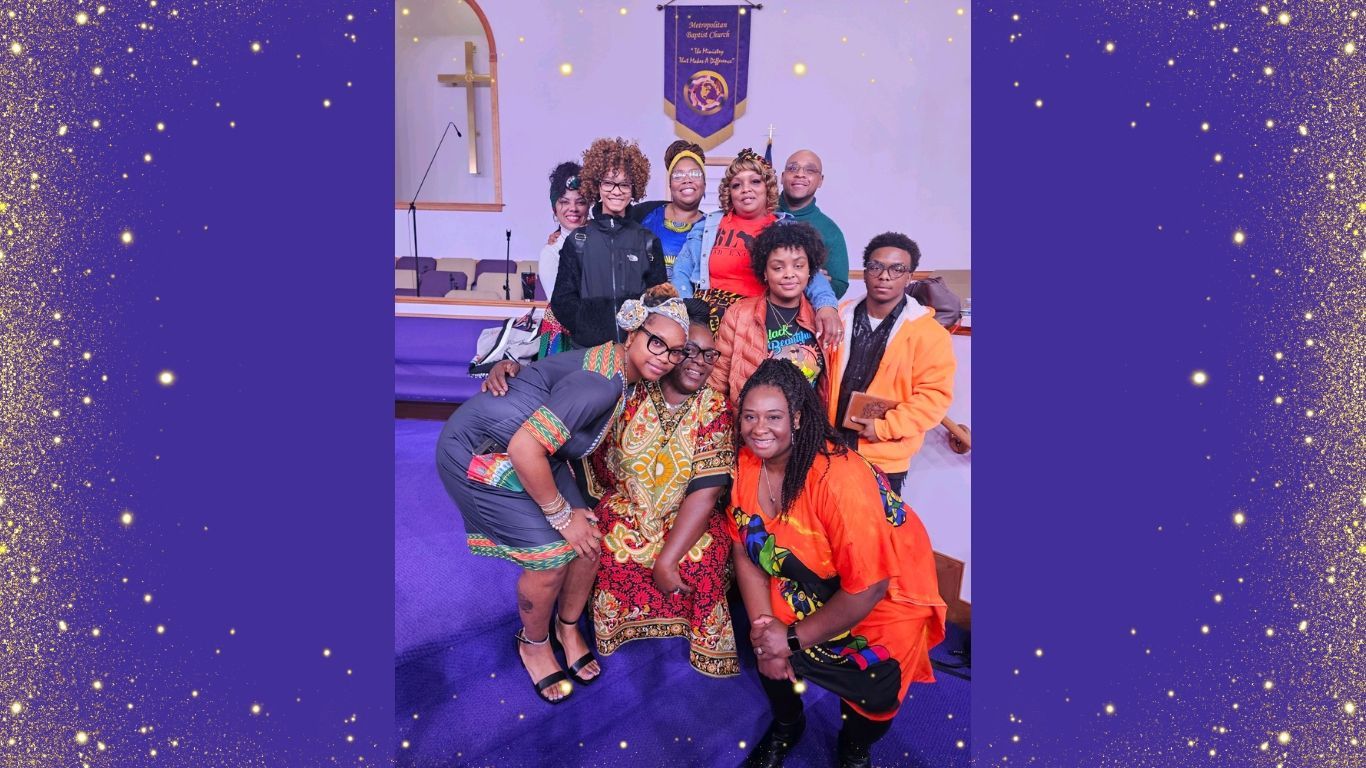 A group of people are posing for a picture in a church.