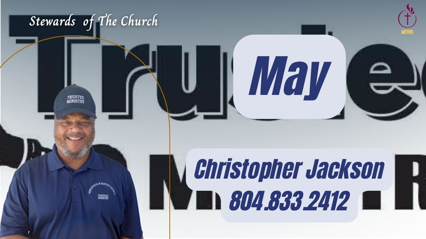 A man standing in front of a sign that says april