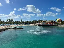 There is a fountain in the middle of the water.