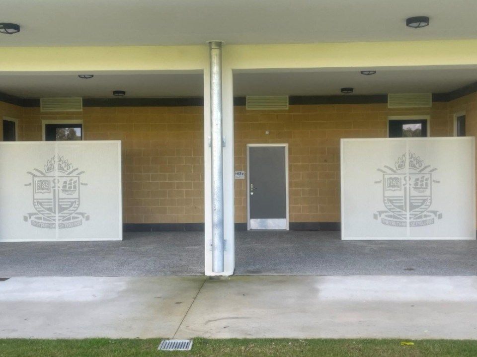A building with a shield on the side of it
