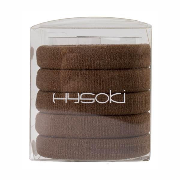 Una pila de cintas para el pelo de color marrón en una caja transparente