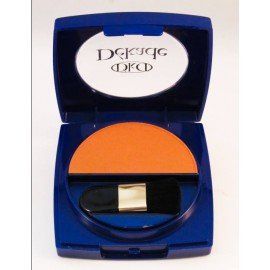 Una sombra de ojos naranja en un recipiente azul con un pincel.