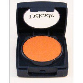 Una sombra de ojos naranja en un recipiente negro con la palabra dermacol.