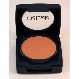 Un recipiente con polvo de dek9ge sobre una superficie blanca.